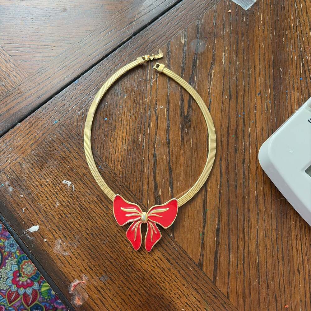 Trifari Gold-Tone Necklace with Red Enamel Bow Pendant